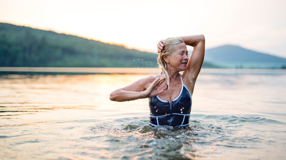 Wild swimming woman lake